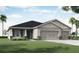 Two-story house with a two-car garage and a landscaped front yard at 549 Silver Course Radl, Ocala, FL 34472