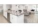 Modern kitchen with white cabinets and granite countertops at 549 Silver Course Radl, Ocala, FL 34472