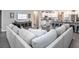 Spacious living room featuring a large sectional sofa and open floor plan at 549 Silver Course Radl, Ocala, FL 34472