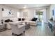 Living room with sectional sofa and sliding glass doors at 549 Silver Course Radl, Ocala, FL 34472