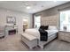 Main bedroom with king bed, fireplace, and ensuite bath at 549 Silver Course Radl, Ocala, FL 34472