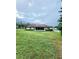 Spacious backyard with large grassy area and screened patio at 5805 Danterbury Ct, Lakeland, FL 33810