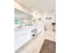 Double vanity bathroom with large mirror and tiled floor at 5805 Danterbury Ct, Lakeland, FL 33810