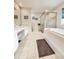 Bathroom with double vanity, bathtub, and large shower at 5805 Danterbury Ct, Lakeland, FL 33810