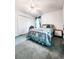 Bedroom with a queen-size bed, ceiling fan, and dresser at 5805 Danterbury Ct, Lakeland, FL 33810
