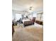 Primary bedroom with king-size bed, wood furniture and carpet at 5805 Danterbury Ct, Lakeland, FL 33810