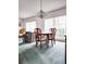 Dining area with a table, four chairs, and a chandelier at 5805 Danterbury Ct, Lakeland, FL 33810
