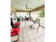 Relaxing screened porch with seating and tiled floor at 5805 Danterbury Ct, Lakeland, FL 33810