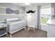 Charming Bedroom with crib, rocker, and playful decor at 721 Bayside Blvd, Winter Haven, FL 33881