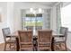 Spacious dining room with large table and view to backyard at 721 Bayside Blvd, Winter Haven, FL 33881