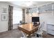 Bright home office features built-in shelving and a large desk at 721 Bayside Blvd, Winter Haven, FL 33881