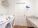 Convenient laundry room with washer, dryer, and counter space at 721 Bayside Blvd, Winter Haven, FL 33881