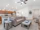 Open concept living room with a large sectional and hardwood floors at 721 Bayside Blvd, Winter Haven, FL 33881