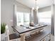 Farmhouse-style dining room with a dark wood table and bench seating at 734 Sw 77Th Cir, Ocala, FL 34474