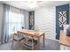 Bright home office with a chevron accent wall and wood desk at 734 Sw 77Th Cir, Ocala, FL 34474