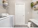 Bright laundry room, featuring washer, dryer, and ample storage at 734 Sw 77Th Cir, Ocala, FL 34474