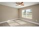 Well-lit bedroom with neutral walls, carpet flooring and ceiling fan at 1021 Rhodes S Rd, Haines City, FL 33844
