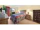 Main bedroom with a queen bed, private access to patio, and two nightstands at 4241 Oak Loop # 36, Mulberry, FL 33860