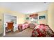 Bedroom with two twin beds, a built-in desk, and ample natural light at 4241 Oak Loop # 36, Mulberry, FL 33860