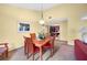 Condo dining room with a wooden table and chairs at 4241 Oak Loop # 36, Mulberry, FL 33860