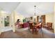 Dining area with a wooden table and chairs, near the kitchen at 4241 Oak Loop # 36, Mulberry, FL 33860