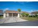 Tan two-story home with carport and landscaped yard at 4241 Oak Loop # 36, Mulberry, FL 33860