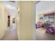 Hallway with carpet flooring and access to bedrooms and the kitchen at 4241 Oak Loop # 36, Mulberry, FL 33860