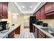 Efficient kitchen with a laundry area and modern appliances at 4241 Oak Loop # 36, Mulberry, FL 33860
