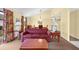 Open concept living area with a red sofa and dining area at 4241 Oak Loop # 36, Mulberry, FL 33860