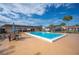Community pool with ample seating and covered area at 4241 Oak Loop # 36, Mulberry, FL 33860