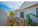 Landscaped backyard with tropical plants and stone pathway at 4243 Oak Loop # 35, Mulberry, FL 33860