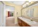 Double vanity bathroom with a large mirror and brown cabinets at 4243 Oak Loop # 35, Mulberry, FL 33860
