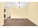 Dining room with neutral carpeting and a light fixture at 4243 Oak Loop # 35, Mulberry, FL 33860