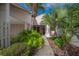 Landscaped entryway leading to front door at 4243 Oak Loop # 35, Mulberry, FL 33860