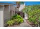 Inviting entryway with lush landscaping and a private walkway at 4243 Oak Loop # 35, Mulberry, FL 33860