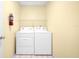 Laundry room with washer, dryer, and overhead shelving at 4243 Oak Loop # 35, Mulberry, FL 33860