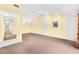 Spacious living room with vaulted ceilings and neutral carpeting at 4243 Oak Loop # 35, Mulberry, FL 33860