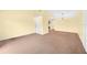 Open living room with vaulted ceilings and neutral carpeting at 4243 Oak Loop # 35, Mulberry, FL 33860