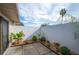 Private patio with mature plantings and pavers at 4243 Oak Loop # 35, Mulberry, FL 33860