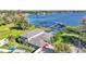 Aerial view of the house, pool, and private dock on the lake at 809 Fairlane Dr, Lakeland, FL 33809