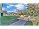Landscaped backyard with fire pit and seating area at 809 Fairlane Dr, Lakeland, FL 33809