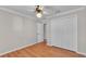 Spacious bedroom featuring wood floors and a double door closet at 809 Fairlane Dr, Lakeland, FL 33809