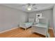 Two twin beds in a well-lit bedroom with hardwood floors at 809 Fairlane Dr, Lakeland, FL 33809