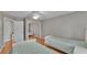 Bedroom with two twin beds and hardwood floors at 809 Fairlane Dr, Lakeland, FL 33809