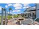 Lakefront fire pit with seating for outdoor enjoyment at 809 Fairlane Dr, Lakeland, FL 33809