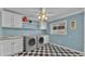 Laundry room with washer, dryer, and checkerboard floor at 809 Fairlane Dr, Lakeland, FL 33809