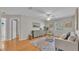 Living room with light walls, wood floors and comfy seating at 809 Fairlane Dr, Lakeland, FL 33809