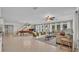 Bright living room featuring tile floors and access to backyard at 809 Fairlane Dr, Lakeland, FL 33809