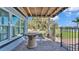 Relaxing brick patio with fire pit and lake view at 809 Fairlane Dr, Lakeland, FL 33809