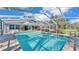 Inviting screened pool with spacious patio at 809 Fairlane Dr, Lakeland, FL 33809